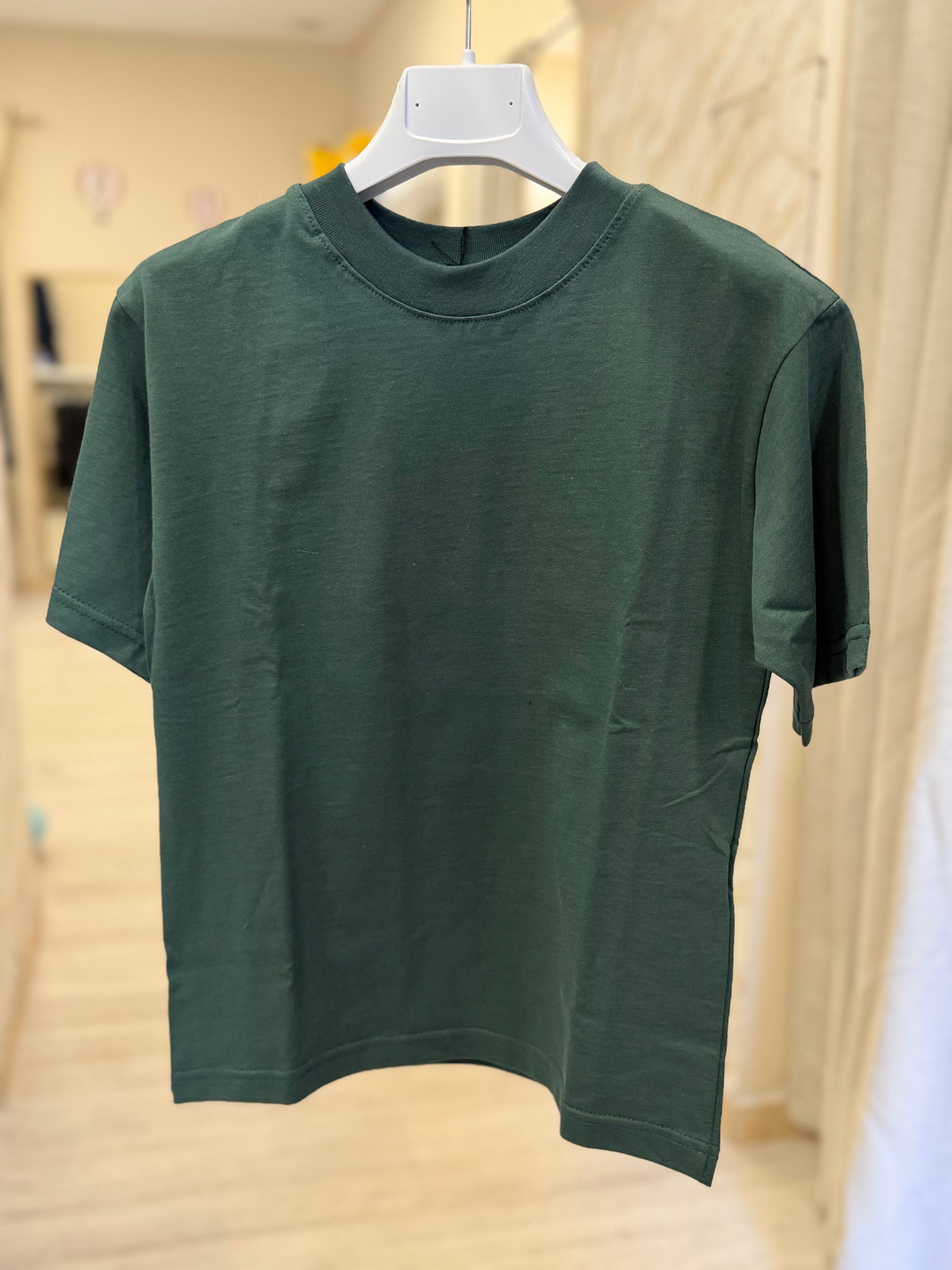 T shirt over green